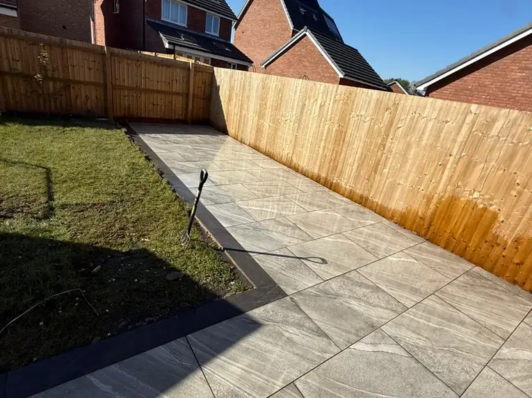 Porcelain by S P Groundworks & Driveways - Grey porcelain in a fenced garden